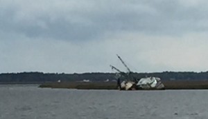 Oops. Hard aground ship is a monumental reminder of the danger of shoaling in the Fernandina area.