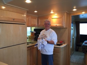 Cruising isn't all fun and games. There's work to be done. Here, Roger takes his frequent turn at KP.