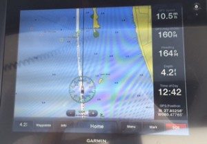 This shot of our electronic chart gives you an idea of just how narrow the ICW channel is. The white indicates navigable water; the blue means shallow.